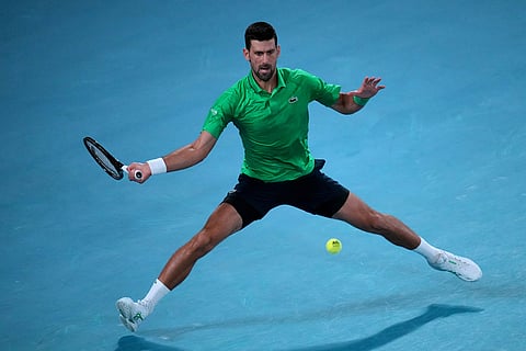 Novak Djokovic of Serbia plays a forehand return to Botic van de Zandschulp of the Netherlands during their third round match at the Australian Open tennis championship in Melbourne, Australia.