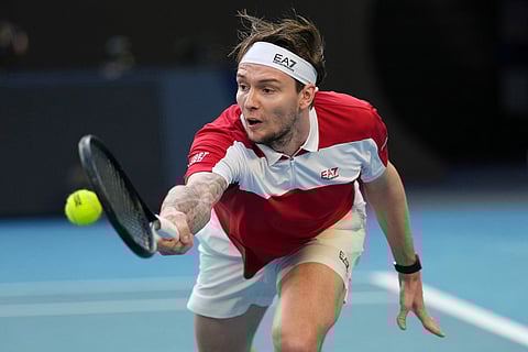 Alexander Bublik of Kazakhstan plays a backhand return to Alex de Minaur of Australia during their fourth round match at the Australian Open tennis championship in Melbourne, Australia.