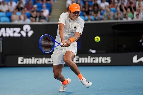 Learner Tien of the U.S. plays a backhand return to Daniil Medvedev of Russia during their fourth round match at the Australian Open tennis championship in Melbourne, Australia.