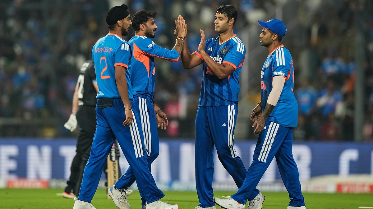 India's Axar Patel, second left, celebrates with teammates after the dismissal of New Zealand's Glenn Phillips during the first T20 cricket match between India and New Zealand in Nagpur, India, Wednesday, Jan. 21, 2026.  - | Photo: AP/Mahesh Kumar A.