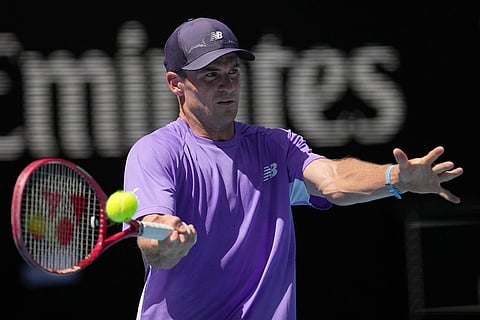 Tommy Paul of the U.S. plays a forehand return to Carlos Alcaraz of Spain during their fourth round match at the Australian Open tennis championship in Melbourne, Australia.