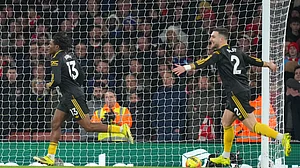 (AP Photo/Kirsty Wigglesworth) : Manchester United's Patrick Dorgu, left, celebrates scoring his side's second goal during the English Premier League soccer match between Arsenal and Manchester United in London, Sunday, Jan. 25, 2026.
