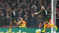 (AP Photo/Kirsty Wigglesworth) : Manchester United's Patrick Dorgu, left, celebrates scoring his side's second goal during the English Premier League soccer match between Arsenal and Manchester United in London, Sunday, Jan. 25, 2026.