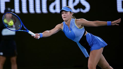 Anna Kalinskaya of Russia plays a forehand return to Iga Swiatek of Poland during their third round match at the Australian Open tennis championship in Melbourne, Australia.