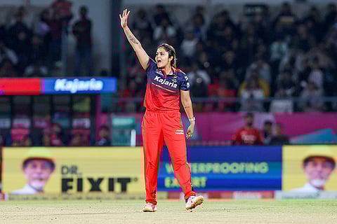 Royal Challengers Bengaluru's Sayali Satghare celebrates after taking the wicket of Delhi Capitals' Shafali Verma during the Women's Premier League (WPL) 2026 T20 cricket match between Royal Challengers Bengaluru and Delhi Capitals, at BCA Stadium, in Vadodara, Gujarat.