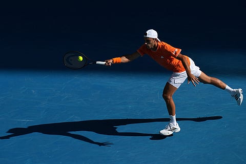 Francisco Cerundolo of Argentina plays a forehand return to Alexander Zverev of Germany during their fourth round match at the Australian Open tennis championship in Melbourne, Australia.