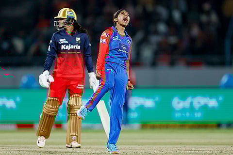 Delhi Capitals' Minnu Mani celebrates the wicket of Royal Challengers Bengaluru's Richa Ghosh during the Women's Premier League (WPL) 2026 T20 cricket match between Royal Challengers Bengaluru and Delhi Capitals, at BCA Stadium, in Vadodara, Gujarat.
