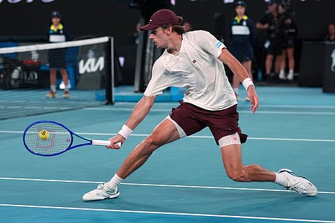 Alex de Minaur of Australia plays a backhand return to Alexander Bublik of Kazakhstan during their fourth round match at the Australian Open tennis championship in Melbourne, Australia.