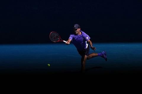 Tommy Paul of the U.S. plays a forehand return to Carlos Alcaraz of Spain during their fourth round match at the Australian Open tennis championship in Melbourne, Australia.