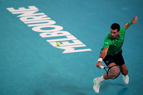 Novak Djokovic of Serbia plays a backhand return to Botic van de Zandschulp of the Netherlands during their third round match at the Australian Open tennis championship in Melbourne, Australia.