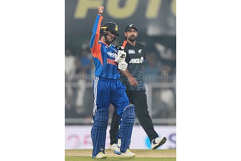 India's Abhishek Sharma celebrates after scoring fifty runs during the third T20 cricket match between India and New Zealand in Guwahati, India.
