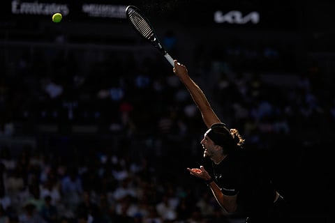 Alexander Zverev of Germany serves to Francisco Cerundolo of Argentina during their fourth round match at the Australian Open tennis championship in Melbourne, Australia.