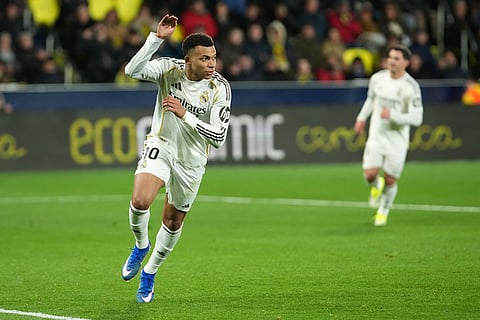 Real Madrid's Kylian Mbappe celebrates after scoring his side's second goal during a Spanish La Liga soccer match between Villarreal and Real Madrid in Villarreal, Spain.