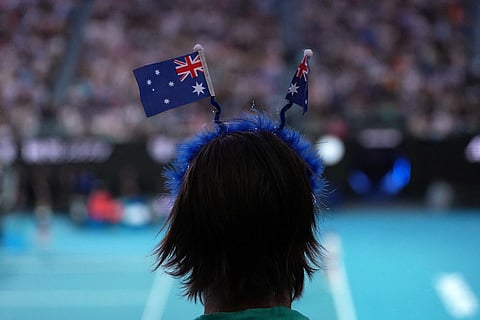 A fan watches the Alex de Minaur of Australia and Alexander Bublik of Kazakhstan fourth round match at the Australian Open tennis championship in Melbourne, Australia.