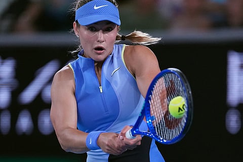 Anna Kalinskaya of Russia plays a backhand return to Iga Swiatek of Poland during their third round match at the Australian Open tennis championship in Melbourne, Australia.