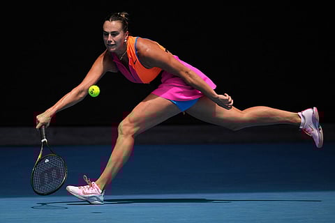 Aryna Sabalenka of Belarus plays a forehand return to Victoria Mboko of Canada during their fourth round match at the Australian Open tennis championship in Melbourne, Australia.
