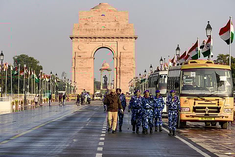 Security personnel are deployed along Kartavya Path near India Gate ahead of the Republic Day celebrations, in New Delhi.