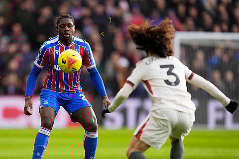 Crystal Palace's Jaydee Canvot, left, and Chelsea's Marc Cucurella in action during the English Premier League soccer match between Crystal Palace and Chelsea in London.