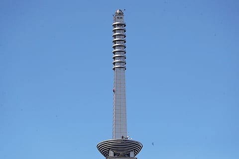 Rock climber Alex Honnold, of the U.S., in a red shirt, performs a free solo climb of the Taipei 101 skyscraper in Taipei, Taiwan.