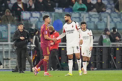 Roma's Lorenzo Pellegrini, left, and AC Milan's Ruben Loftus-Cheek shake hands after the Serie A soccer match between Roma and AC Milan in Rome.