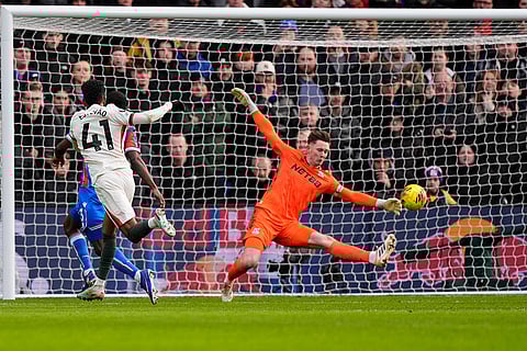 Chelsea's Estevao, left, scores during the English Premier League soccer match between Crystal Palace and Chelsea in London.