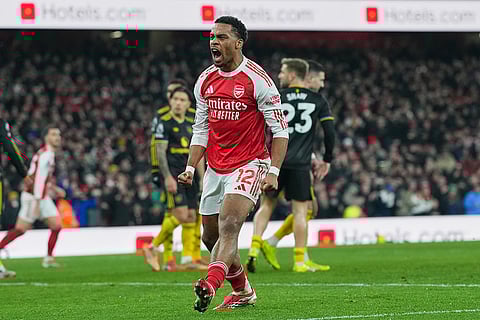 Arsenal's Jurrien Timber celebrates after Mikel Merino scored his side's second goal during the English Premier League soccer match between Arsenal and Manchester United in London.