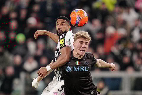 Juventus' Bremer, left, fights for the ball with Napoli's Rasmus Hojlund during the Italian Serie A soccer match between Juventus and Napoli in Turin, Italy.
