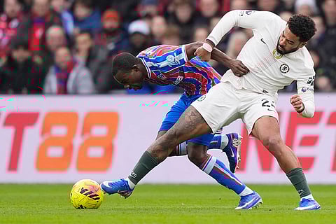 Crystal Palace's Tyrick Mitchell, left, and Chelsea's Reece Jamesa in action during the English Premier League soccer match between Crystal Palace and Chelsea in London.