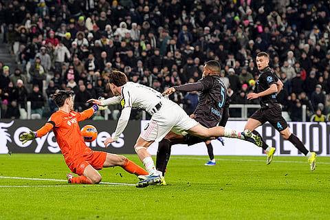 Juventus' Kenan Yildiz scores their side's second goal of the game during the Italian Serie A soccer match between Juventus and Napoli in Turin, Italy.