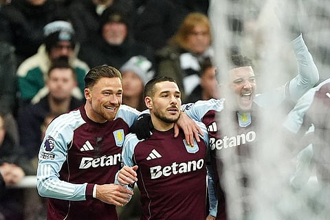 Aston Villa's Emi Buendia, center, celebrates with teammates after scoring their side's first goal during their English Premier League soccer match against Newcastle United in Newcastle upon Tyne, England.