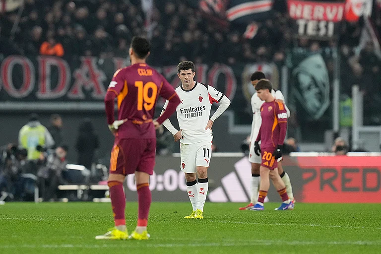 AC Milan's Christian Pulisic, centre, and Roma's Zeki Celik react after the Serie A soccer match between Roma and AC Milan in Rome. - | Photo: AP/Gregorio Borgia