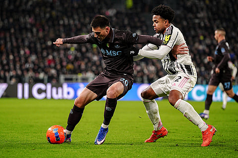 Napoli's Eljif Elmas fights for the ball with Juventus' Weston McKennie, right, during the Italian Serie A soccer match between Juventus and Napoli in Turin, Italy.
