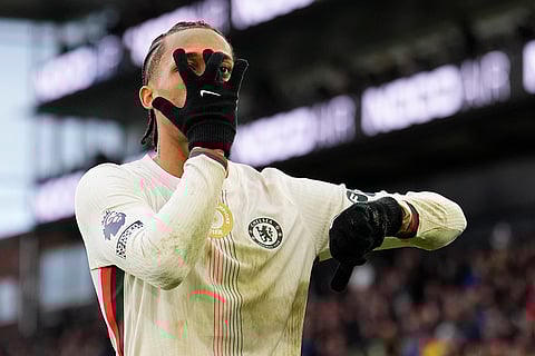 Chelsea's Joao Pedro celebrates scoring during the English Premier League soccer match between Crystal Palace and Chelsea in London.