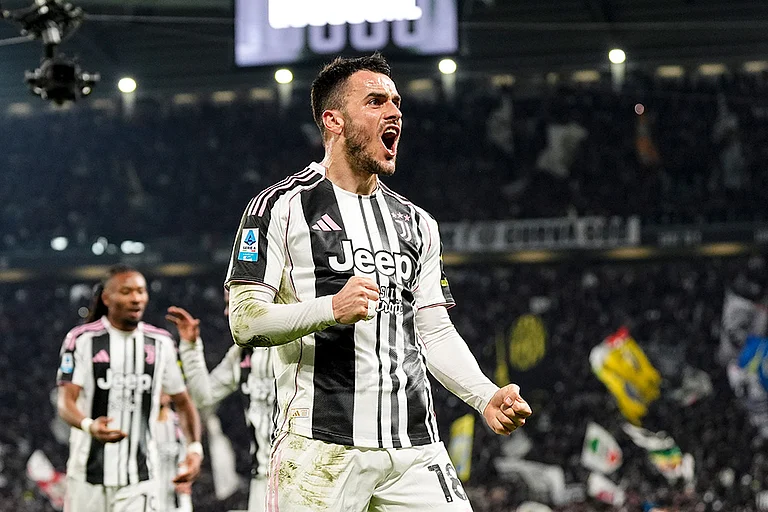 Juventus' Filip Kostic celebrates scoring their side's third goal of the game during the Italian Serie A soccer match between Juventus and Napoli in Turin. - | Photo: Fabio Ferrari/LaPresse via AP