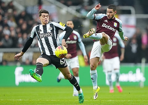 Aston Villa's Emi Buendia, right, and Newcastle United's Lewis Miley battle for the ball during their English Premier League soccer match in Newcastle upon Tyne, England.