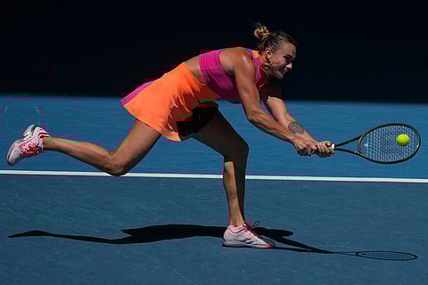 Aryna Sabalenka of Belarus plays a backhand return to Iva Jovic of the U.S. during their quarterfinal match at the Australian Open tennis championship in Melbourne, Australia.