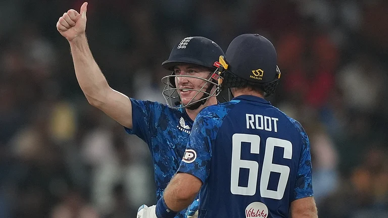 England's captain Harry Brook celebrates his century as Joe Root watches during the third ODI cricket match between England and Sri Lanka in Colombo, Sri Lanka, Tuesday, Jan. 27, 2026 - (AP Photo/Eranga Jayawardena)