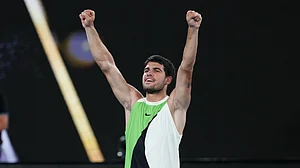 Carlos Alcaraz in action in the Australian Open 2026 quarter-final against Alex de Minaur.