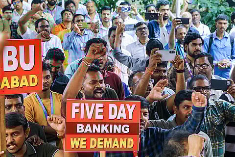 Bank employees shout slogans amid nationwide strike called by United Forum of Bank Unions, demanding the implementation of a five-day workweek, in Hyderabad.