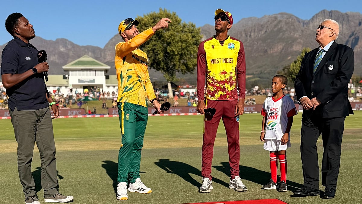 | Photo: X/windiescricket : South Africa's captain Aiden Markram and West Indies' captain Roston Chase at the toss ahead of their first T20I match on January 27, 2026.