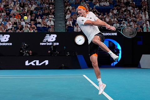 Alexander Zverev of Germany plays a backhand return to Learner Tien of the U.S. during their quarterfinal match at the Australian Open tennis championship in Melbourne, Australia.