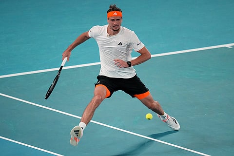 Alexander Zverev of Germany plays a forehand return to Learner Tien of the U.S. during their quarterfinal match at the Australian Open tennis championship in Melbourne, Australia.