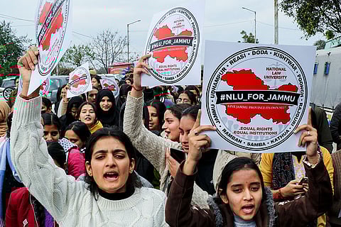 Students of the University of Jammu shout slogans during a rally, demanding the establishment of a National Law University, in Jammu.