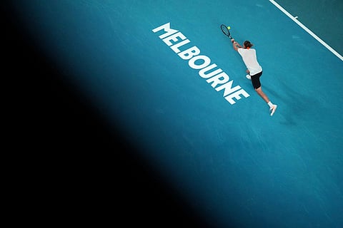 Alexander Zverev of Germany plays a backhand return to Learner Tien of the U.S. during their quarterfinal match at the Australian Open tennis championship in Melbourne, Australia.