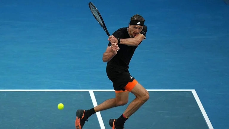Alexander Zverev of Germany plays a backhand return to Francisco Cerundolo of Argentina during their fourth round match at the Australian Open tennis championship in Melbourne, Australia. - | Photo: AP/Dar Yasin