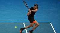 | Photo: AP/Dar Yasin : Alexander Zverev of Germany plays a backhand return to Francisco Cerundolo of Argentina during their fourth round match at the Australian Open tennis championship in Melbourne, Australia.