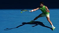 | Photo: AP/Dar Yasin : Carlos Alcaraz of Spain plays a forehand return to Tommy Paul of the U.S.during their fourth round match at the Australian Open tennis championship in Melbourne, Australia.
