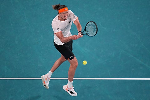 Alexander Zverev of Germany plays a backhand return to Learner Tien of the U.S. during their quarterfinal match at the Australian Open tennis championship in Melbourne, Australia.