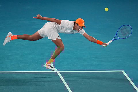 Learner Tien of the U.S. plays a forehand return to Alexander Zverev of Germany during their quarterfinal match at the Australian Open tennis championship in Melbourne, Australia.