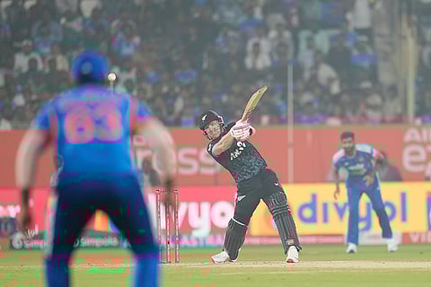 New Zealand's Tim Seifert hits a boundary during the fourth T20 cricket match between India and New Zealand in Visakhapatnam.